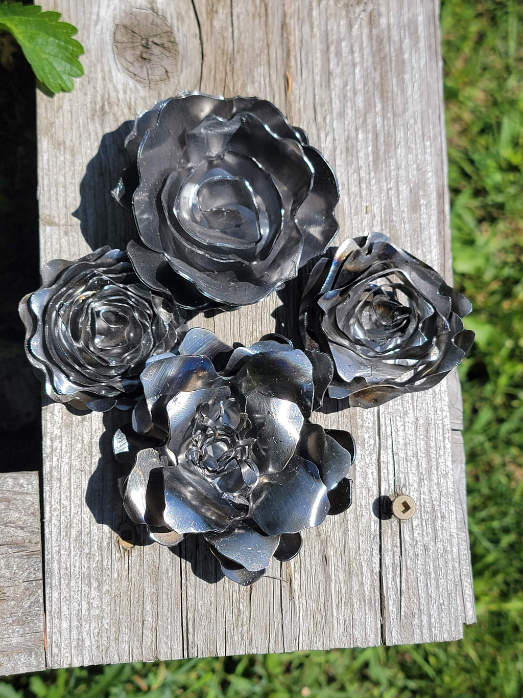 Five Rolled Metal Flowers finished metal example