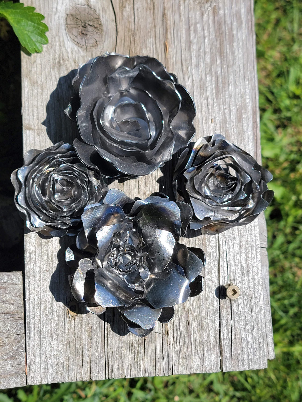 Five Rolled Metal Flowers finished metal example