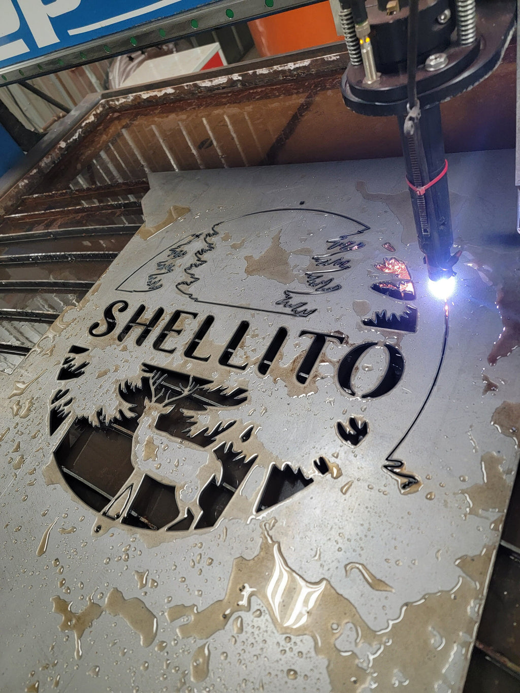 CNC plasma cutting the Personalized Deer Family Name Monogram design