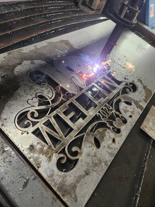 CNC plasma cutting the W Scroll Heart Monogram design