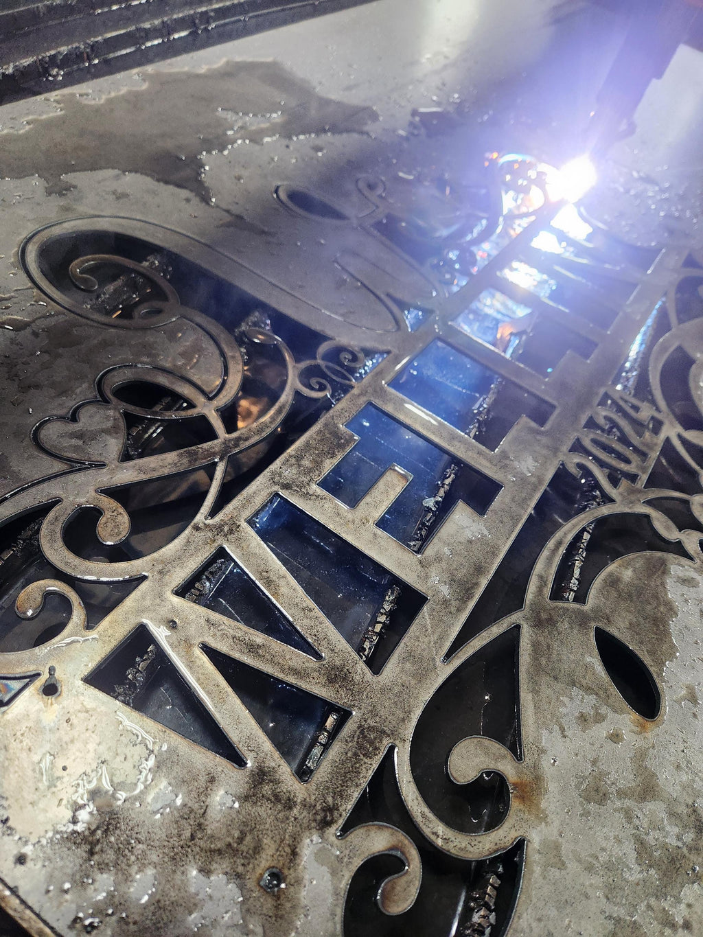 CNC plasma cutting the W Scroll Heart Monogram design (photo 3)