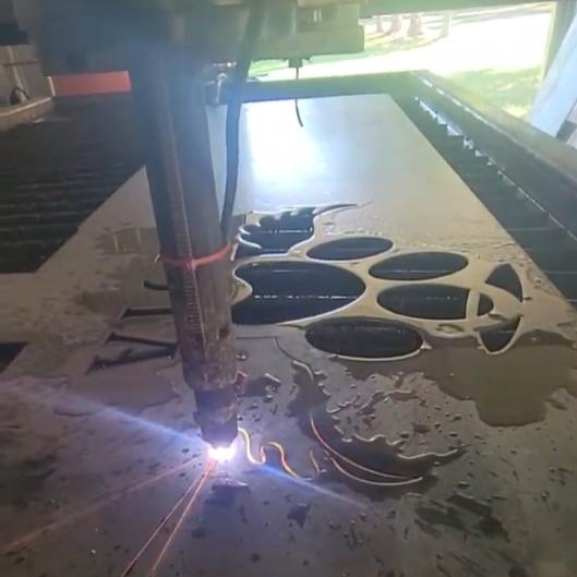 CNC plasma cutting the Dog Paw Halo Memorial Sign Pack design (photo 7)