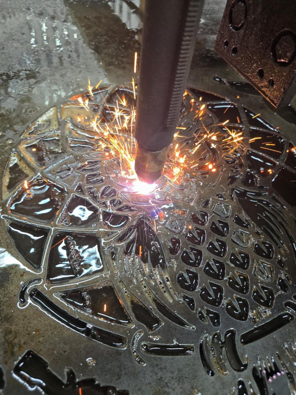 CNC plasma cutting the Owl Feather Wind Chime design