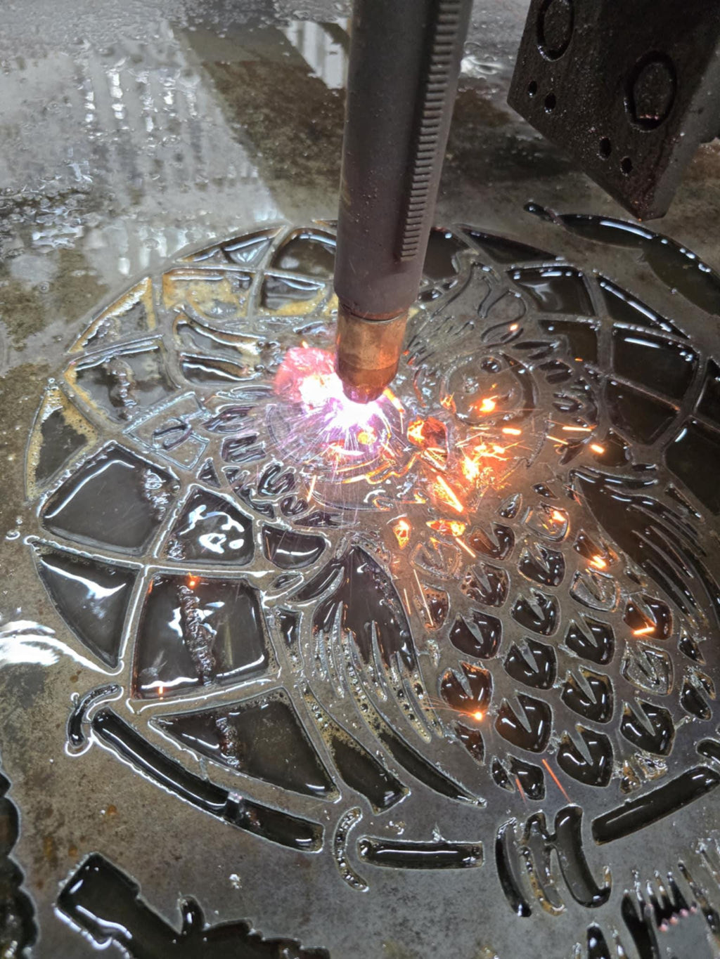 CNC plasma cutting the Owl Feather Wind Chime design (photo 10)