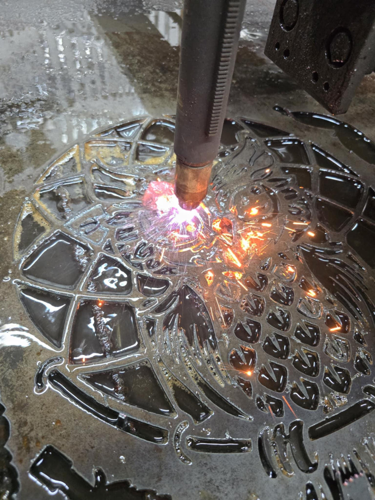 CNC plasma cutting the Owl Feather Wind Chime design (photo 10)