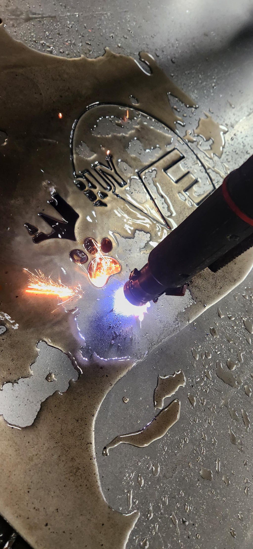 CNC plasma cutting the Rescue Love Dog Sign design