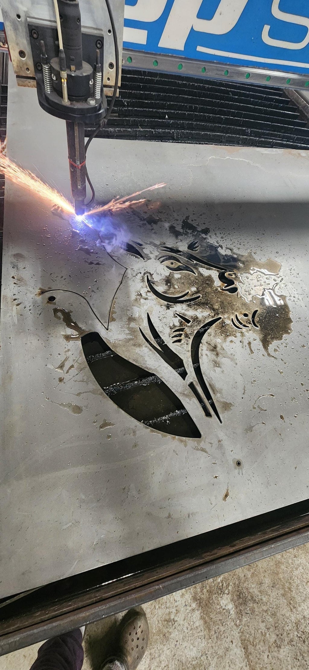 CNC plasma cutting the Buck Duck Fish Sign design
