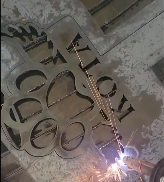 CNC plasma cutting the Dog Paw Halo Memorial Sign Pack design