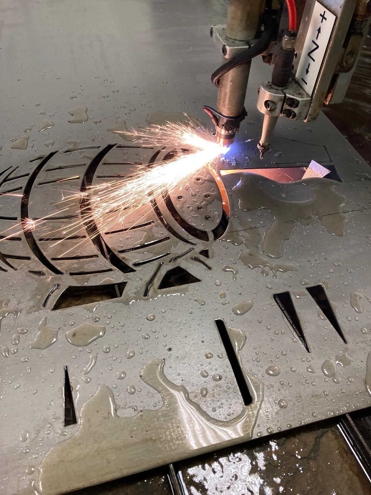 CNC plasma cutting the Bourbon Barrel Pour Name Sign design