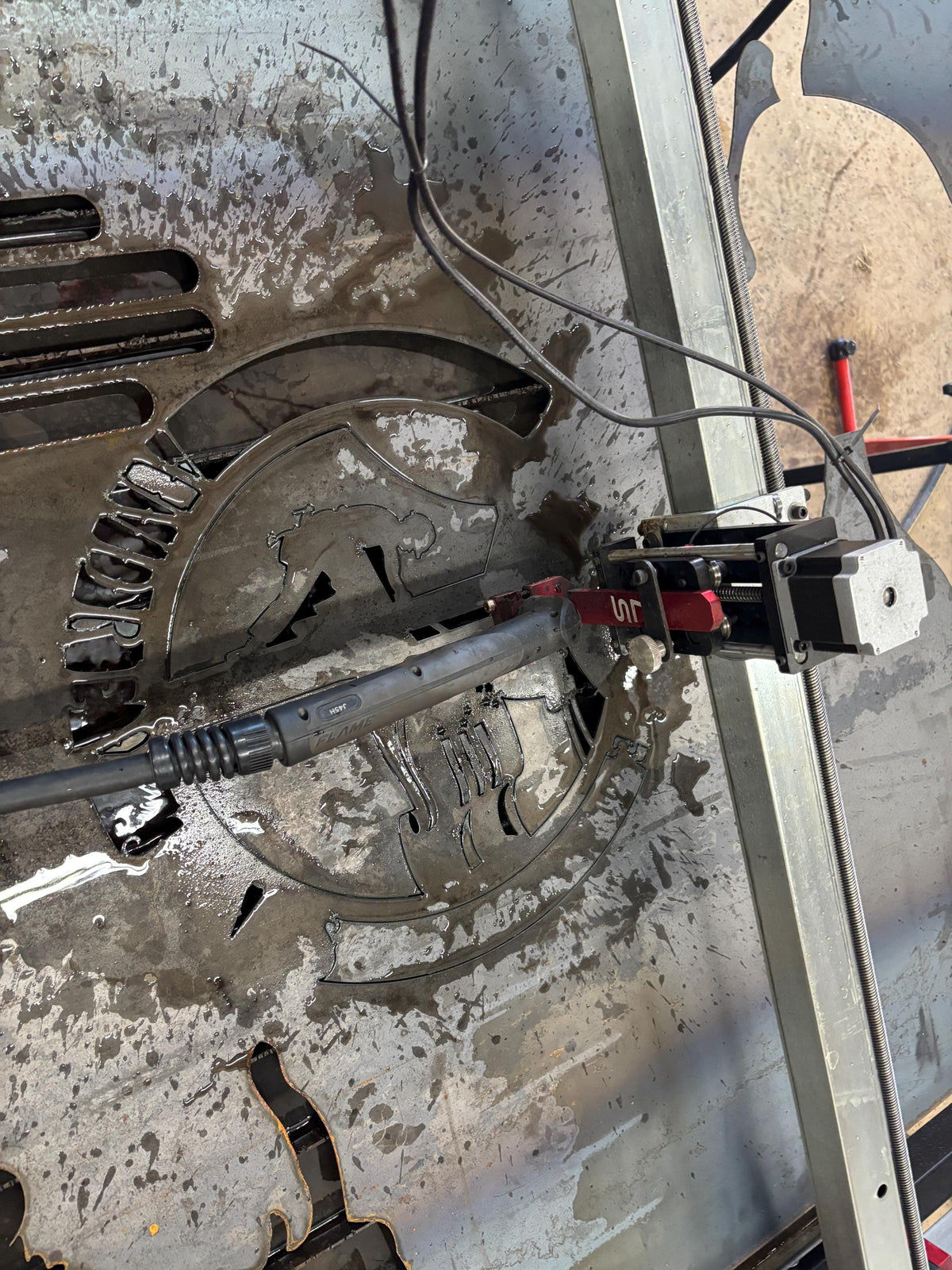CNC plasma cutting the Journeyman Lineman Sign design